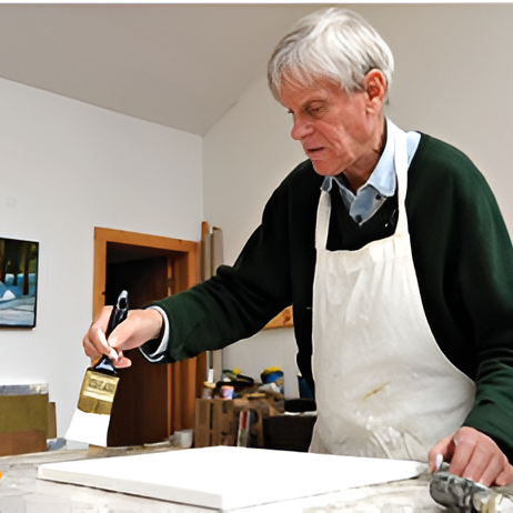 Elderly painter working on artwork